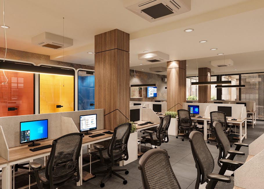 Bright and spacious modern open office interior with workstations and colorful elements.